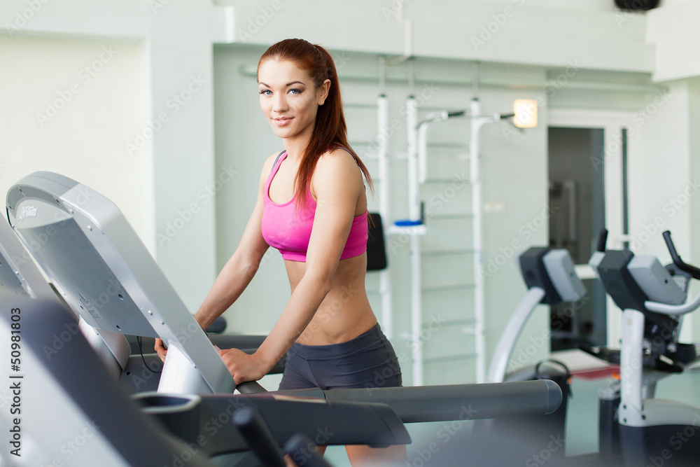 fitness model runs on treadmill, is engaged in fitness club fitness model runs on treadmill, is engaged in fitness club