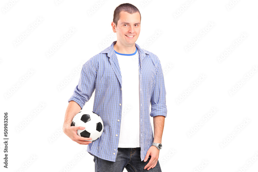 A young man holding a football