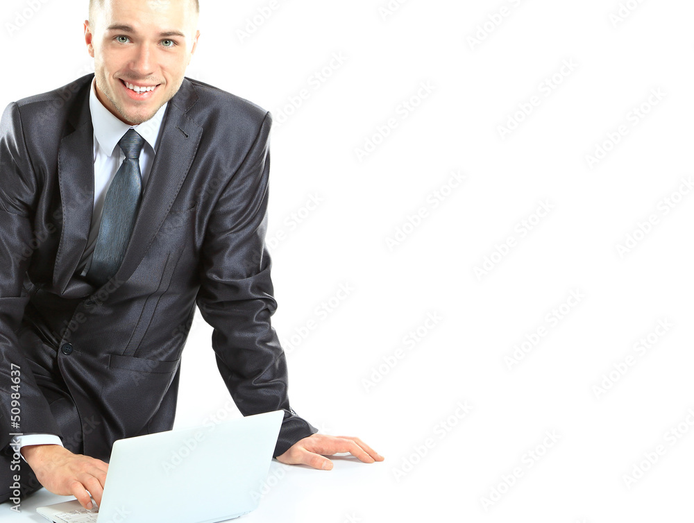 Executive sitting on the floor cross-legged with laptop Executive sitting on the floor cross-legged with laptop