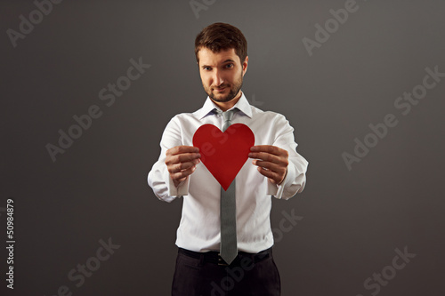 man showing red heart © ArtFamily