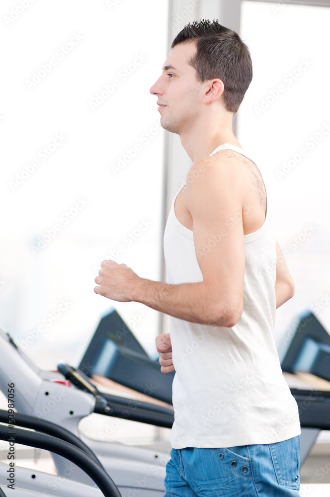 Man at the gym exercising. Run.