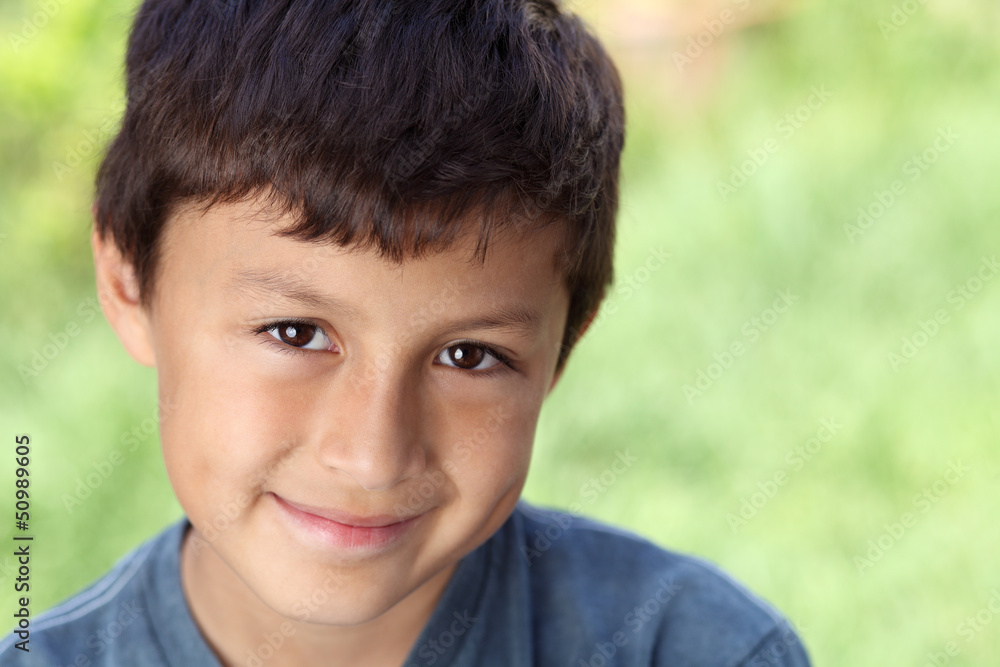 Smiling young boy outside with copy space to right Smiling young boy outside with copy space to right