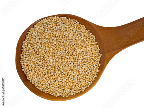 Quinoa on wooden spoon isolated over white background