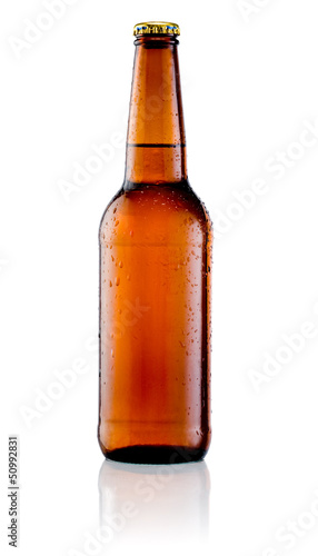 Brown bottle of beer with drops on a white background