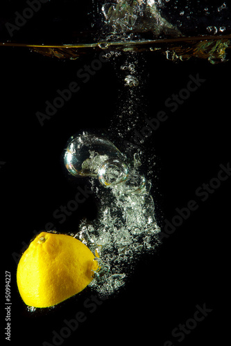 fresh lemon under water