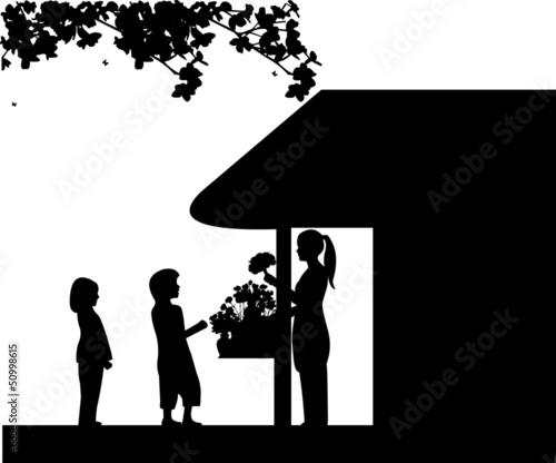 Florist girl holding a flowers in flower shop and sales the boy