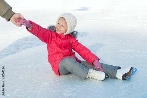 A child learns to skate photo