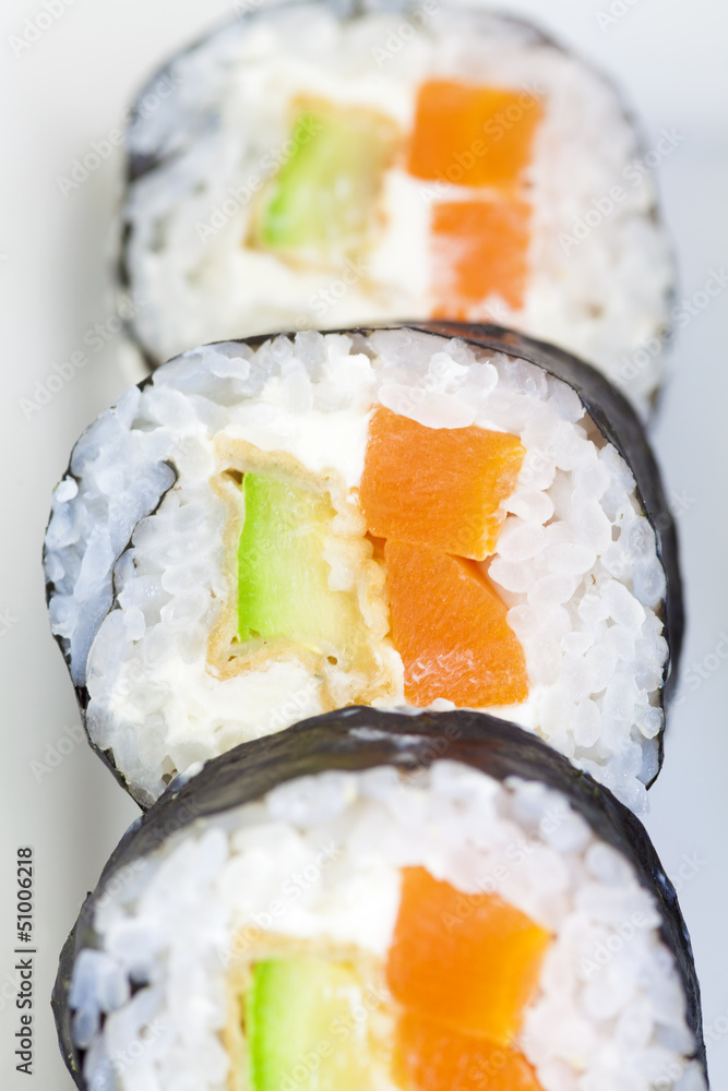 sushi in row on white plate, close-up sushi in row on white plate, close-up