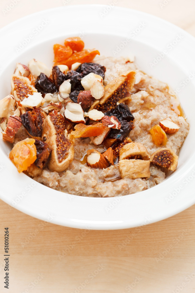 oatmeal with raisins, nuts and maple syrup oatmeal with raisins, nuts and maple syrup