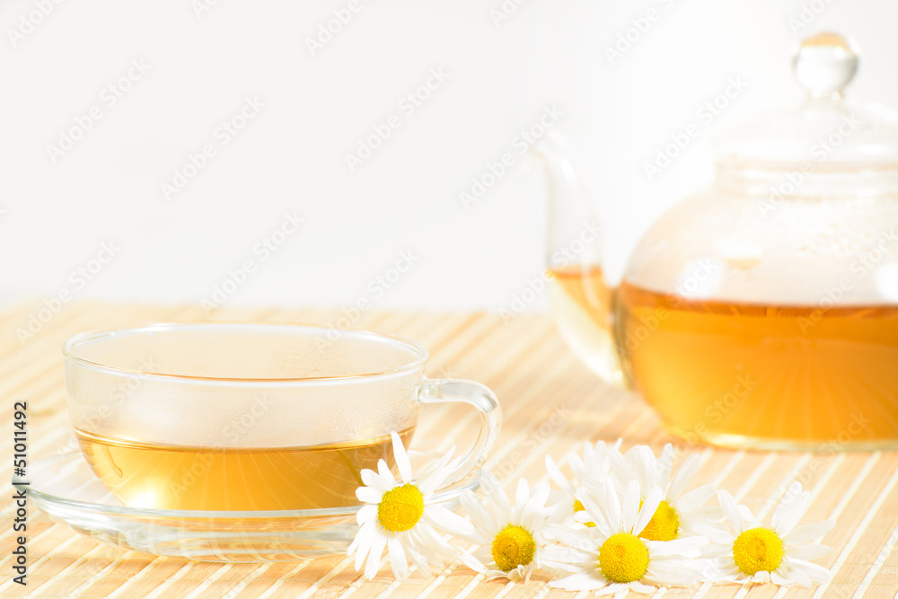 teacup with herbal chamomile tea