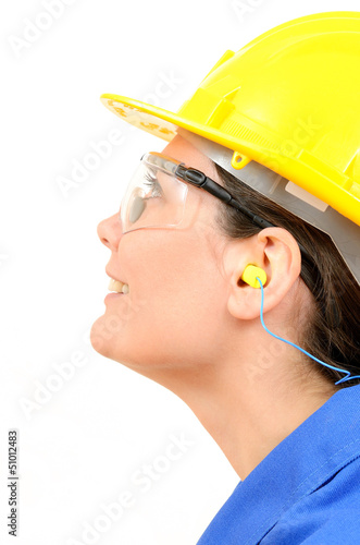 Woman with protective equipment and ear plugs