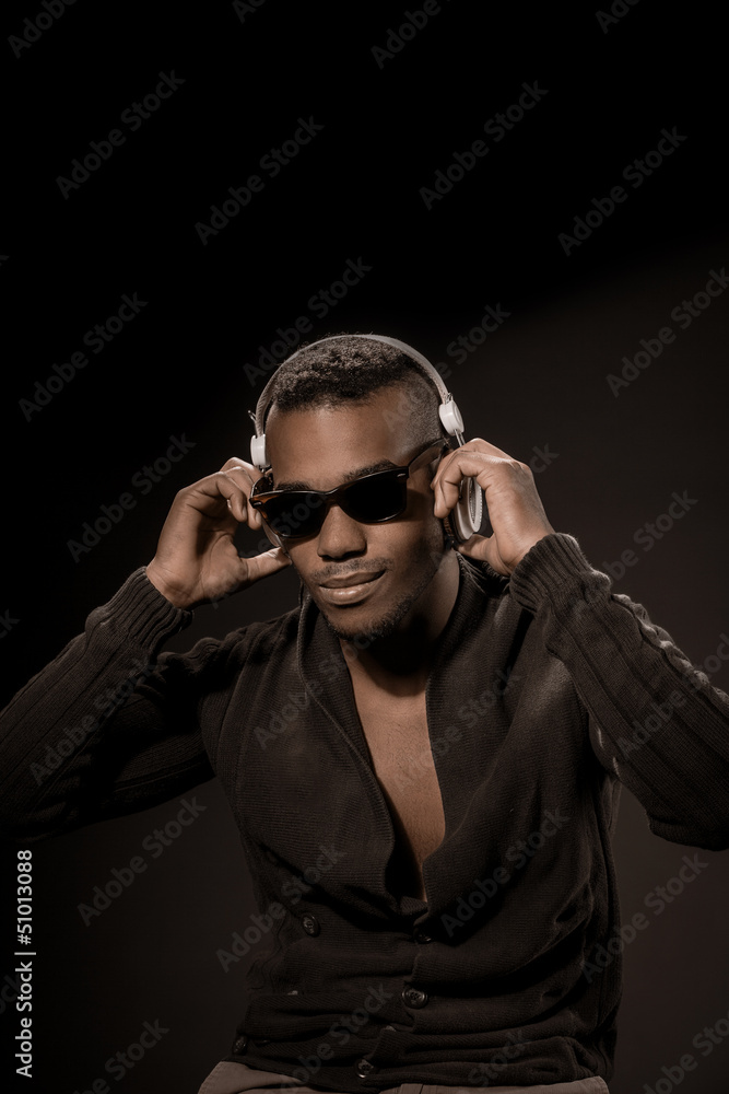 Fototapeta premium Afro American Guy with headphones listen to music