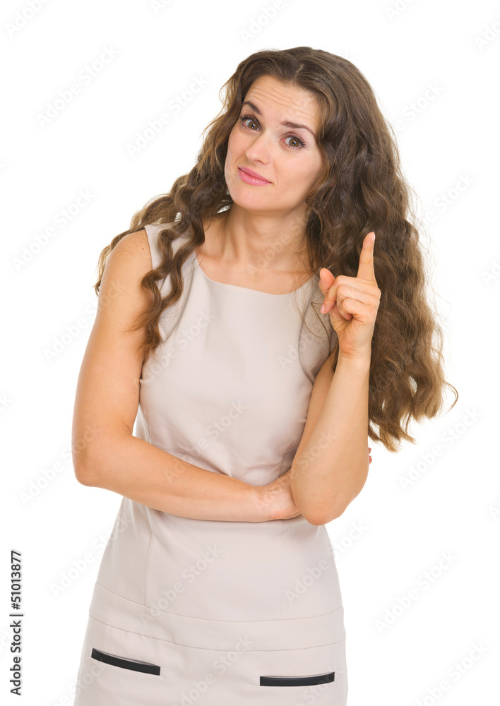 Portrait of interested young woman pointing on fact Portrait of interested young woman pointing on fact