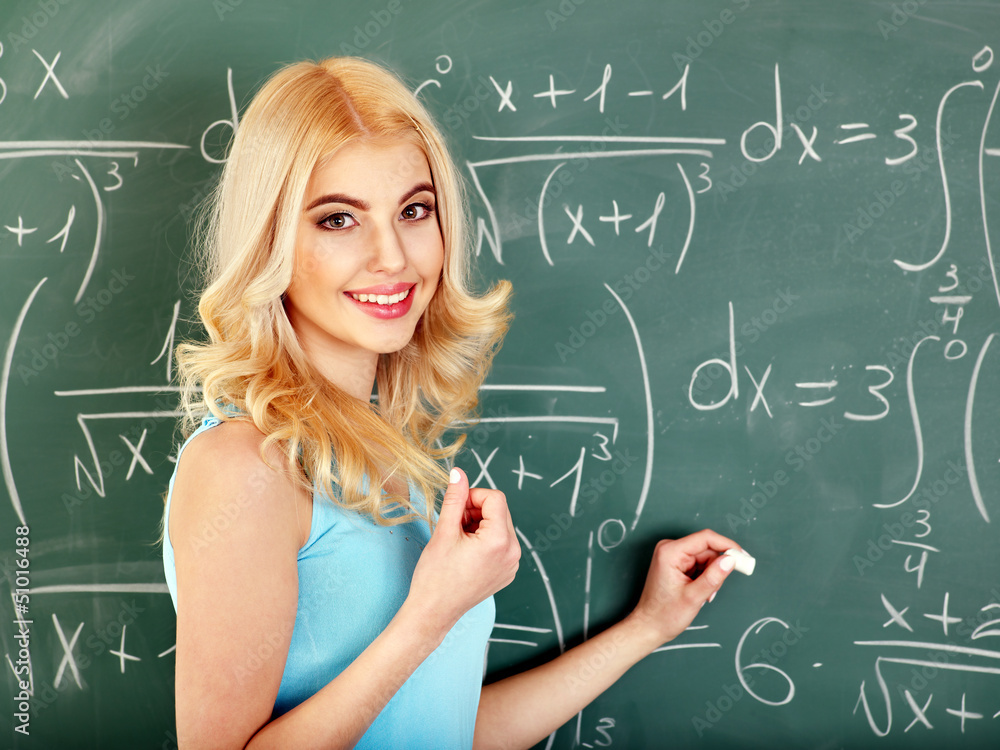 Schoolchild writing on blackboard. Schoolchild writing on blackboard.