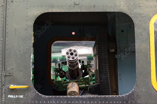 Konstfotografi minigun in the door helicopter Bell UH-1 Iroquois