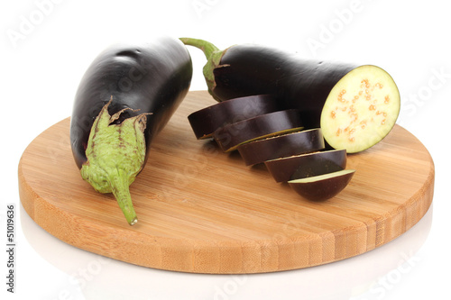Sliced eggplant on chopping board isolated on white