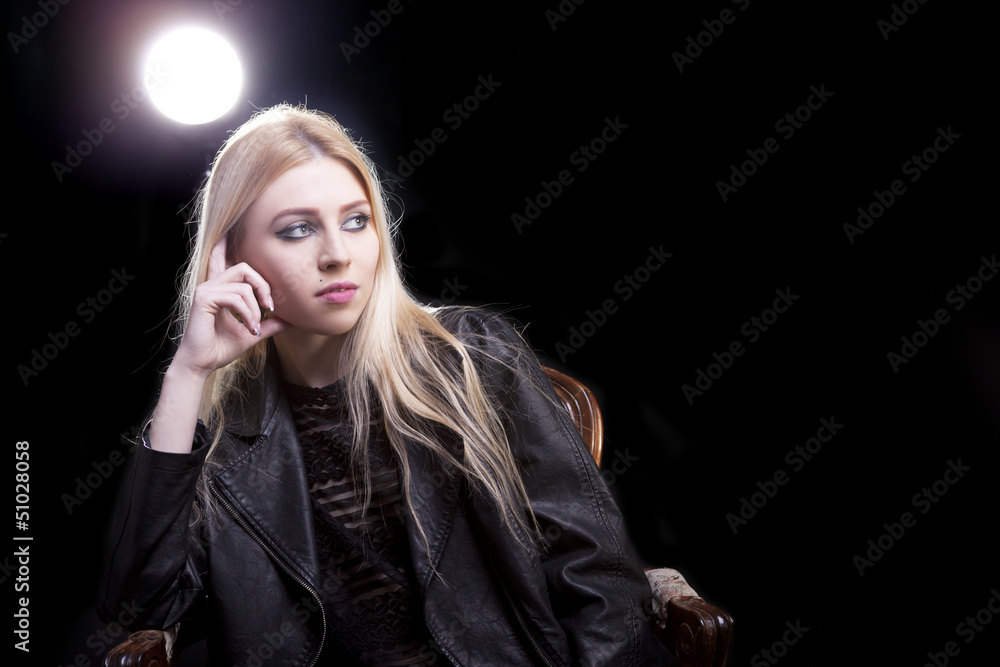 Gorgeous blonde thinking light behind her Gorgeous blonde thinking light behind her