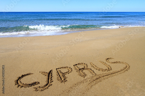 Cyprus written on sandy beach photo