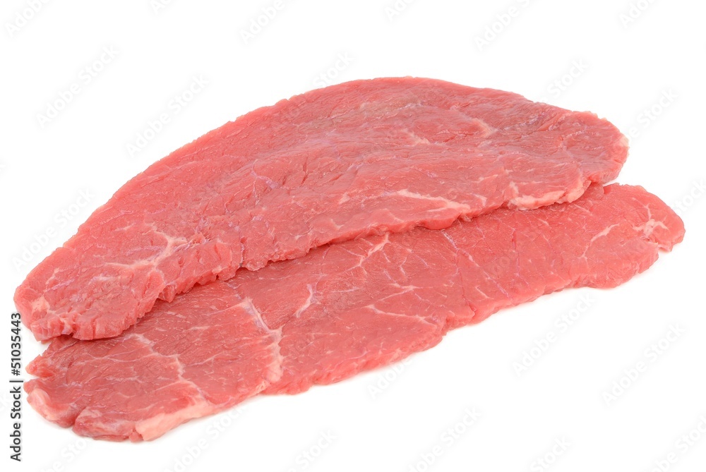 Fresh slices of raw beef meat on a white background