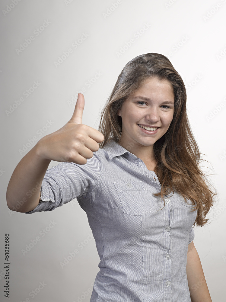 Happy Young Woman Showing Thumb Up Sign Happy Young Woman Showing Thumb Up Sign