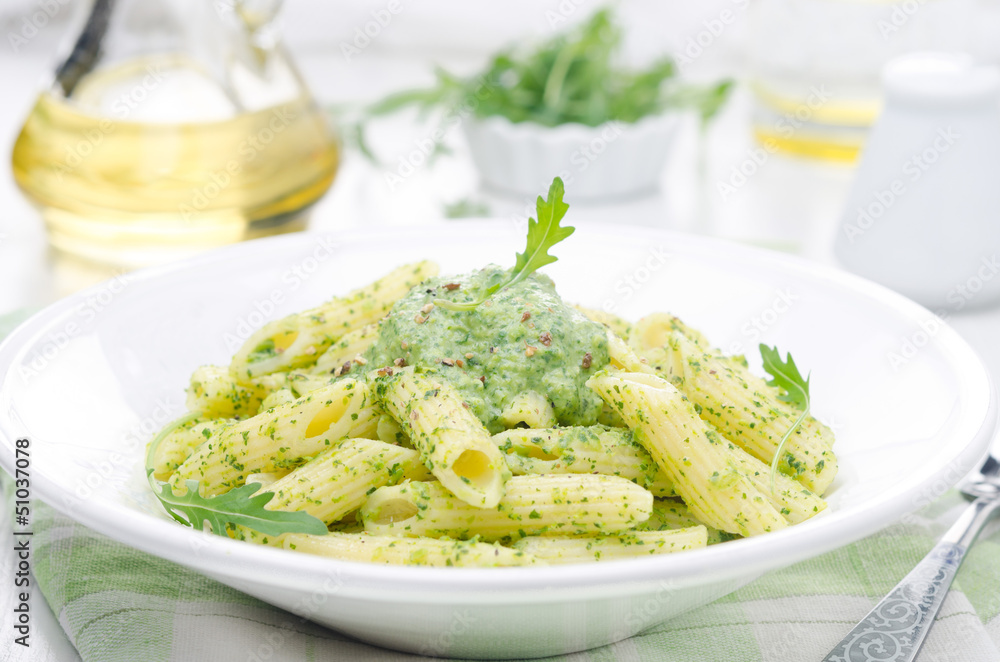 pasta penne with sauce of arugula and green peas close-up pasta penne with sauce of arugula and green peas close-up