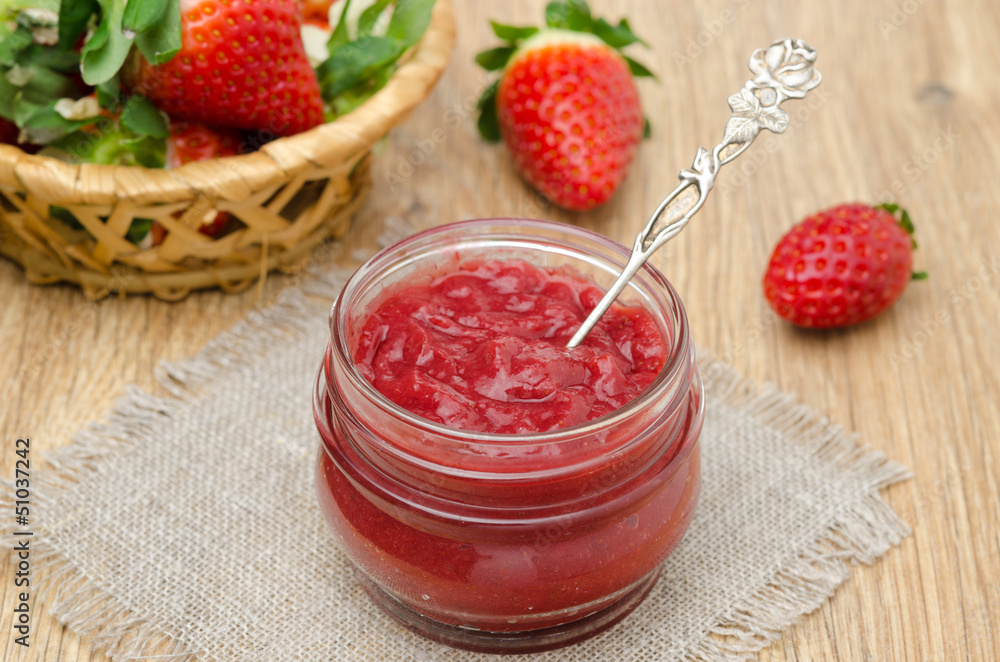 strawberry jam in a glass jar and fresh strawberries horizontal strawberry jam in a glass jar and fresh strawberries horizontal
