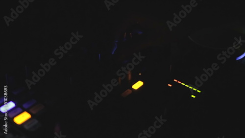 DJ mixes the track in the nightclub photo