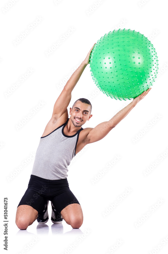 Man with swiss ball doing exercises on white Man with swiss ball doing exercises on white
