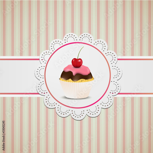 Cupcake with pink creme on lace and striped table cloth
