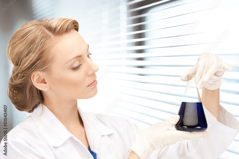 lab worker holding up test tube lab worker holding up test tube