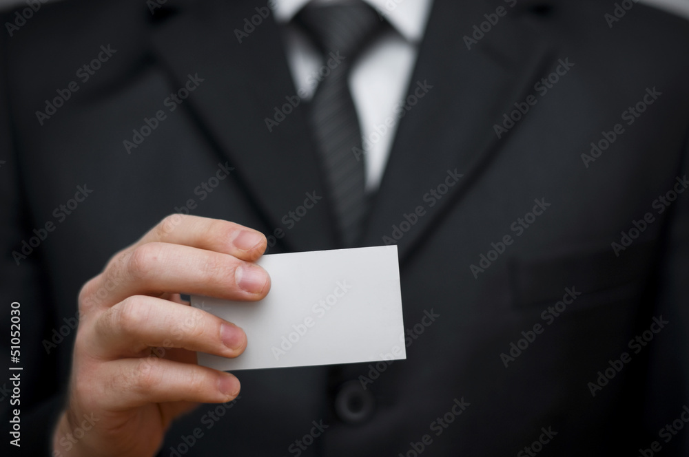 Blank business card in a hand Blank business card in a hand