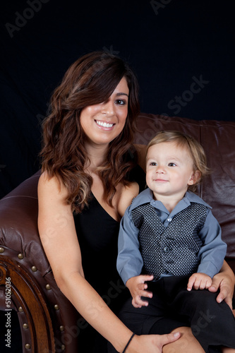 Mother and son sitting together with smies photo