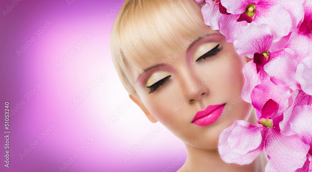 Beautiful blonde woman with flowers and perfect makeup
