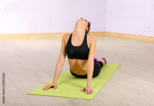 Young woman doing fitness e...