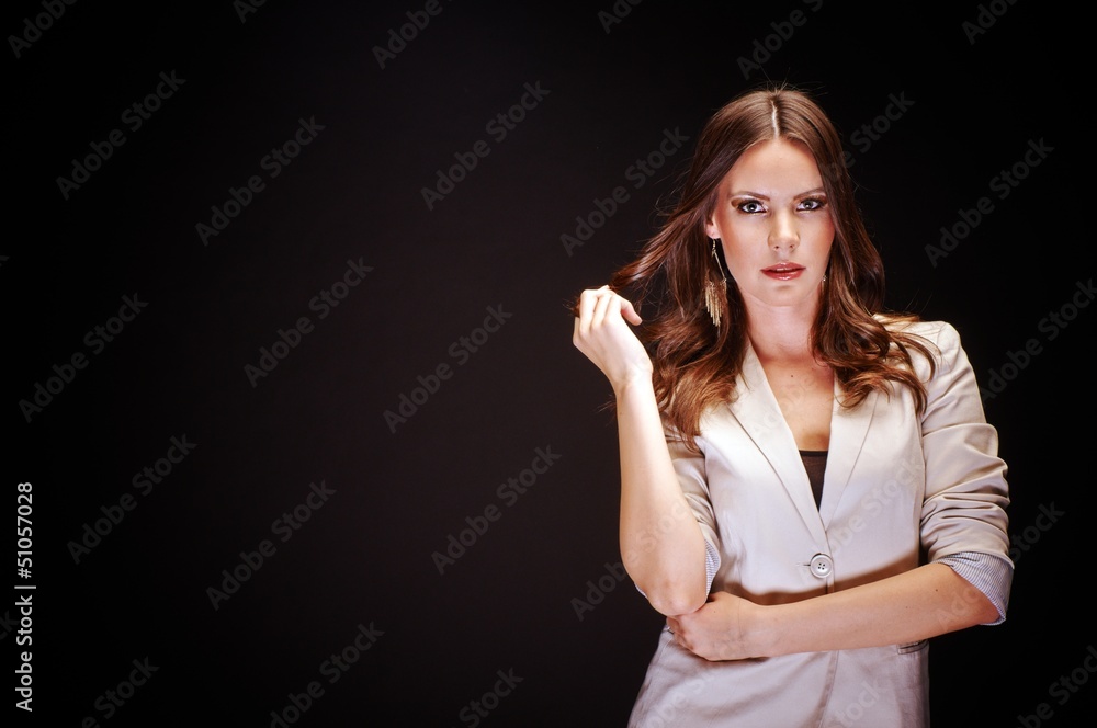 Young woman against dark background Young woman against dark background