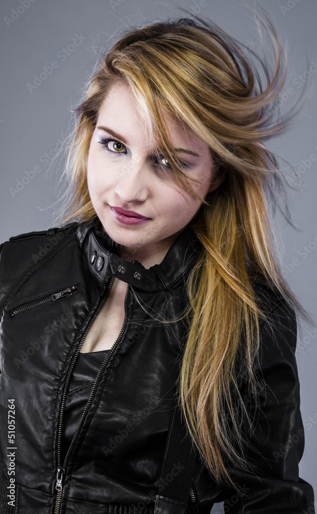 Sexy blonde wearing black leather jacket