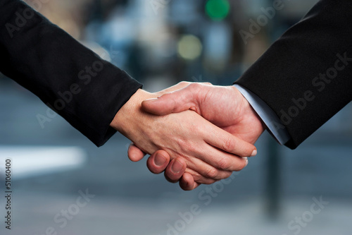 The deal is on. Business handshake
