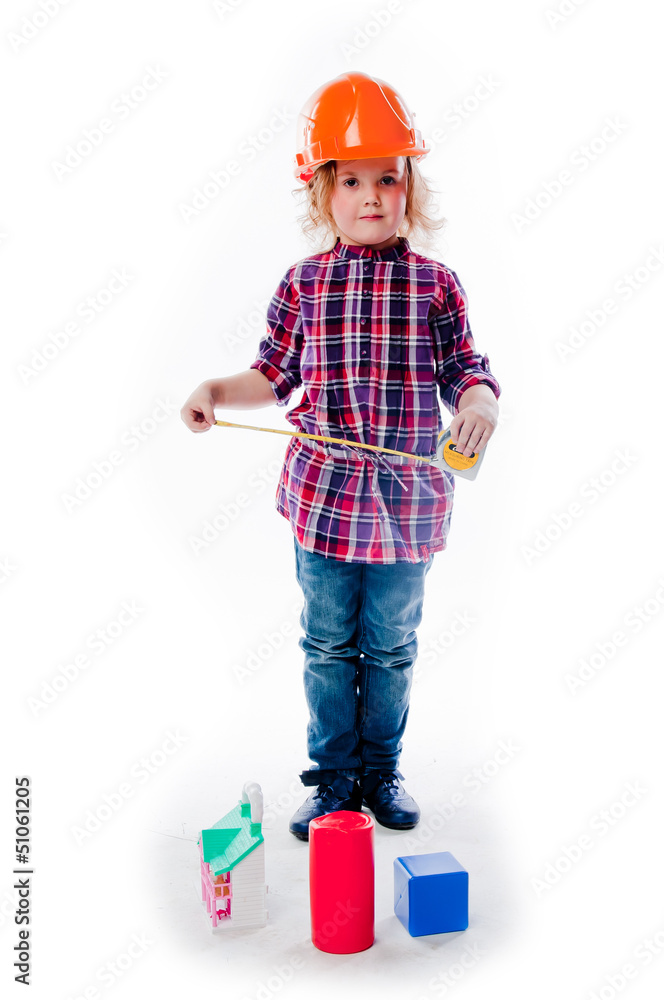 beautiful girl in a building helmet and tools in hand beautiful girl in a building helmet and tools in hand