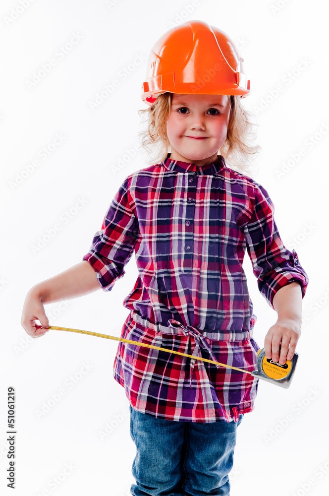 beautiful girl in a building helmet and tools in hand beautiful girl in a building helmet and tools in hand