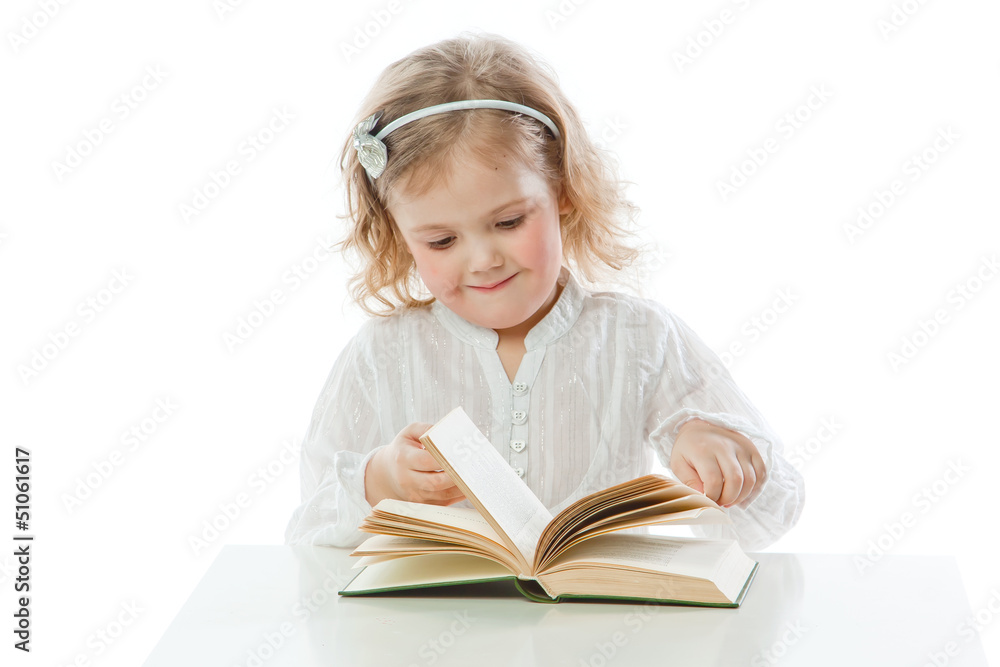 Small and beautiful girl reading a book Small and beautiful girl reading a book