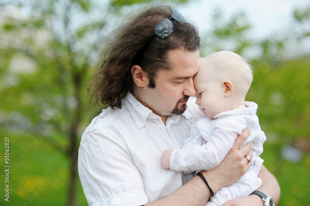 Young father and his little daughter