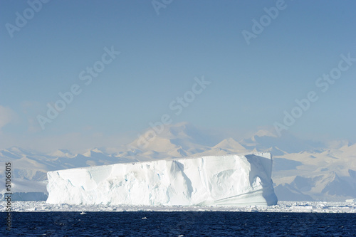 Iceberg in front of coast Antarctica.