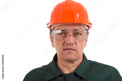 portrait of a workman in overalls and helmet isolated on white b