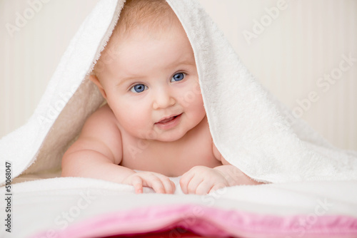 happy baby with towel