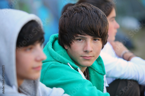 Three teenagers sat together