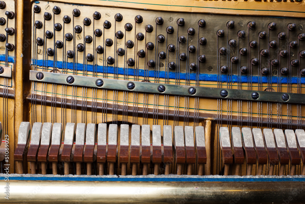 Inside an Upright Piano. Felt Hammers used to strike Steel Stock Photo