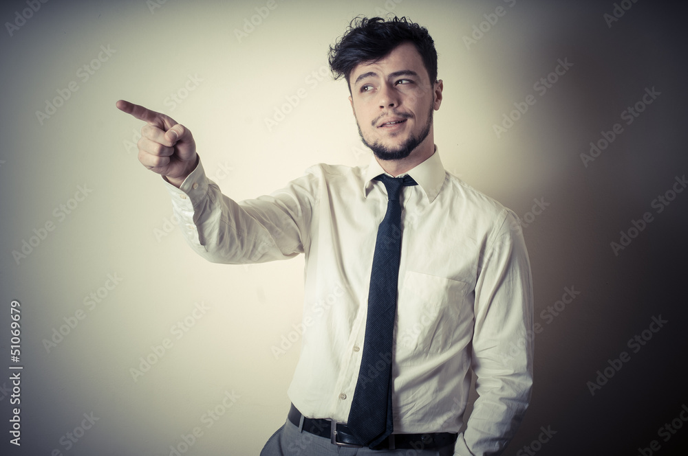 stylish modern guy with white shirt pointing stylish modern guy with white shirt pointing