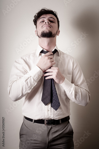 Sexy stylish businessman adjusting tie © Eugenio Marongiu