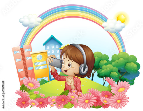 A girl with a headset and a phone with camera
