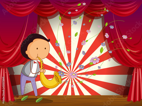A boy playing trombone at the stage